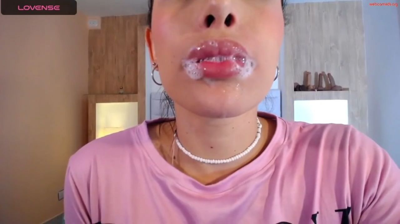 Saliva-drenched dildo play fuels her deep throat expedition