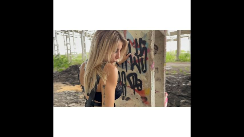 BDSM girl with anal plug in ass.Outdoor