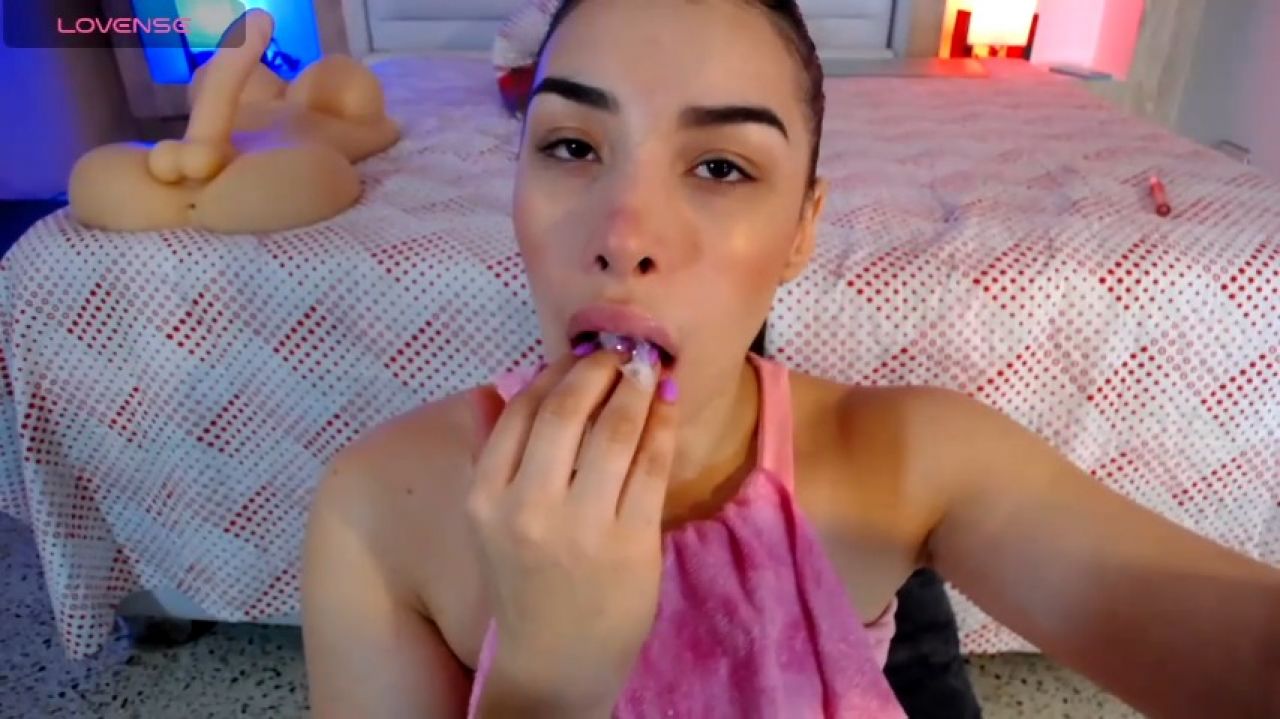 She Licks the Dildo, Making it Wet and Slippery