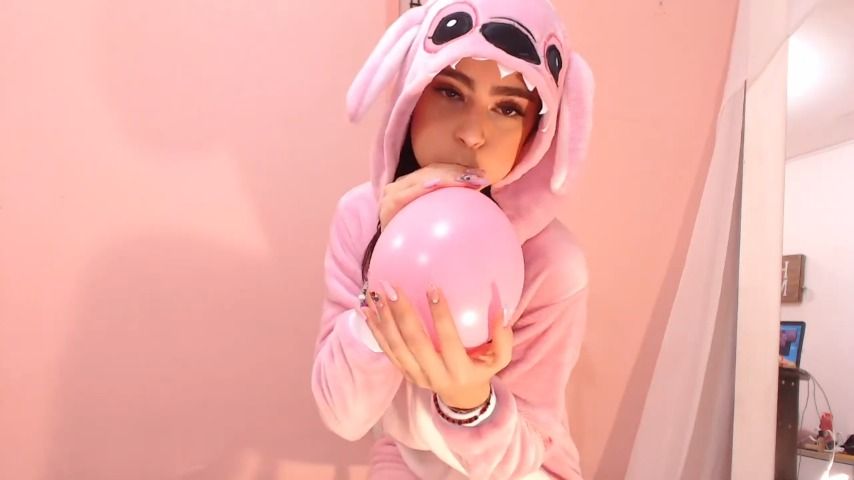 little girl playing with balloons