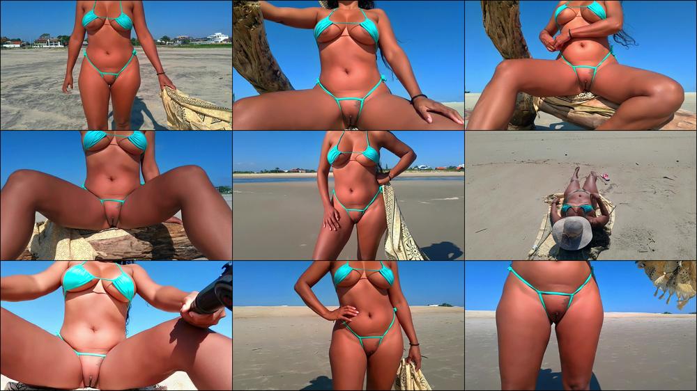 WALKING ON THE BEACH IN A FRONTLESS BIKINI
