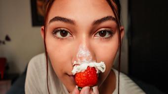placing strawberries and cream on my nose (Cloe stone Scott)