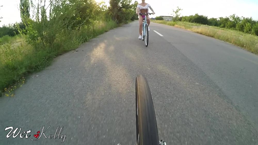 Wet Kelly Riding My Bicycle And Flashing