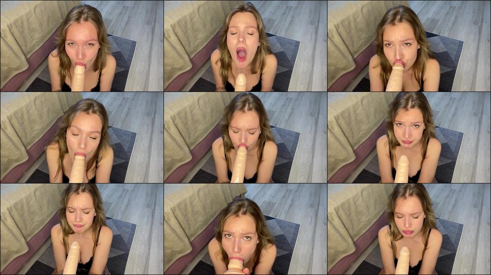 Deeply sucking a big white dildo